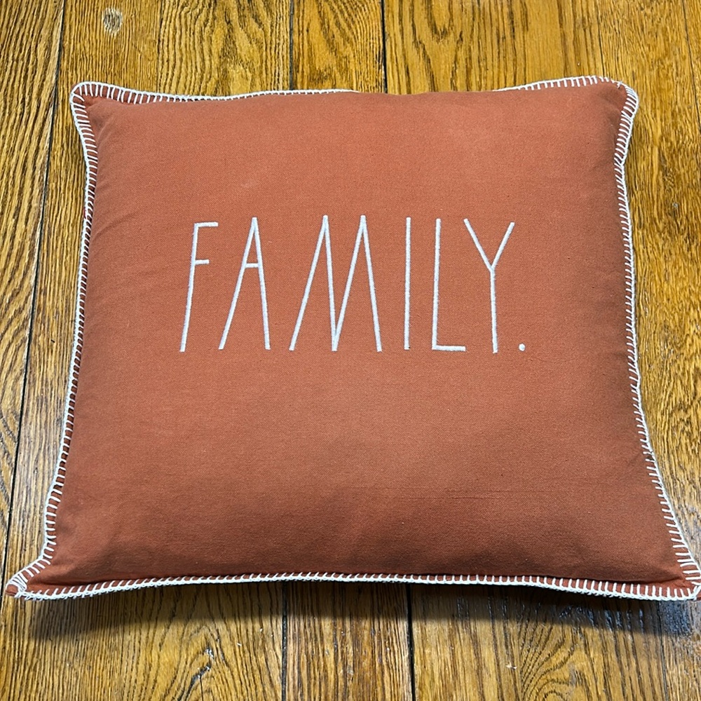 Rae Dunn “Family.” Embroidered 20” burnt orange accent pillow. White whipstitch